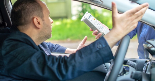 man facing breathalyzer test
